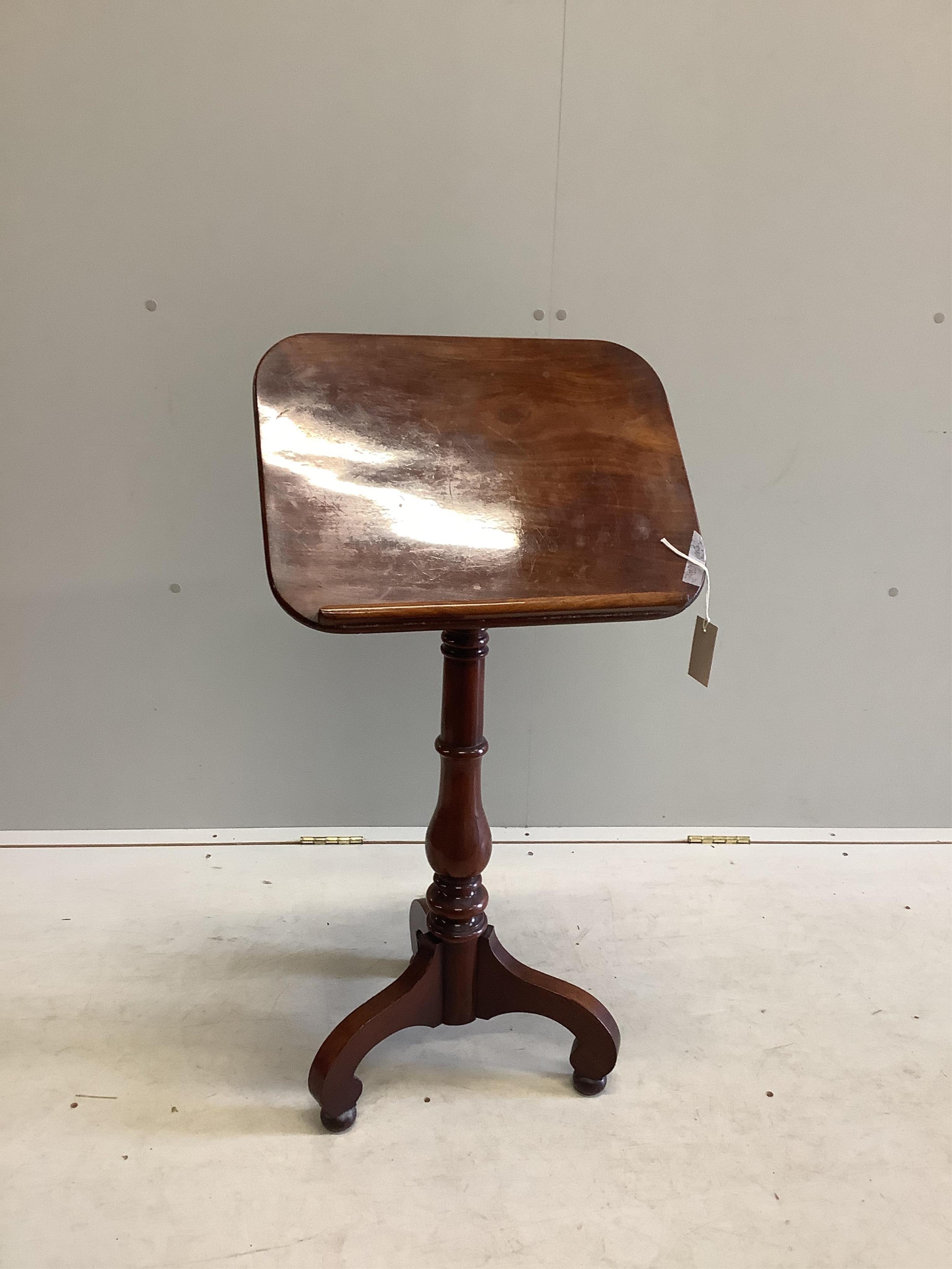 A Victorian mahogany reading table with tilt top, on tripod base, width 45cm, depth 35cm, height 90cm. Condition - fair